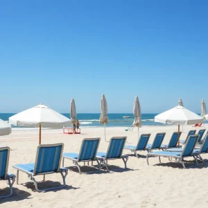 A view of Myrtle Beach showing empty beach chairs and closed umbrellas
