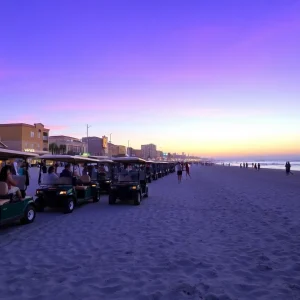 Golf carts parked at Surfside Beach during dusk.
