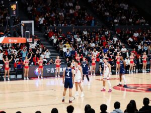 Coastal Carolina women's basketball team celebrating victory at HTC Center