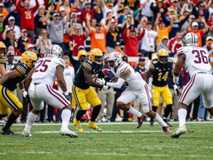 Players competing fiercely during the Independence Bowl game.