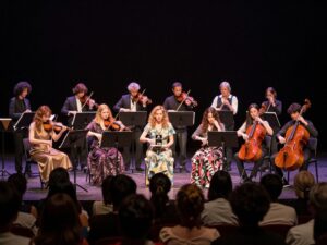 Audience enjoying a live performance at the Greg Rowles Legacy Theatre