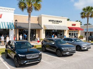 Myrtle Beach with local businesses and luxury vehicles.