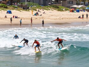 Surfers competing at the Carolina Cup Surf Festival in Surfside Beach.