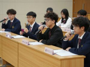 Students participating in a high school debate competition at Conway High School