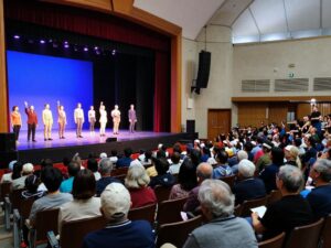 Community members enjoying a live performance at The Greg Rowles Legacy Theatre