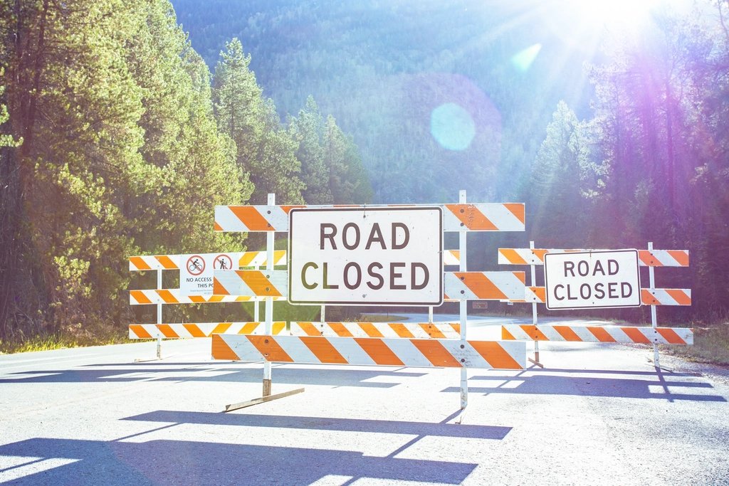 Road closed barricades set up across a street