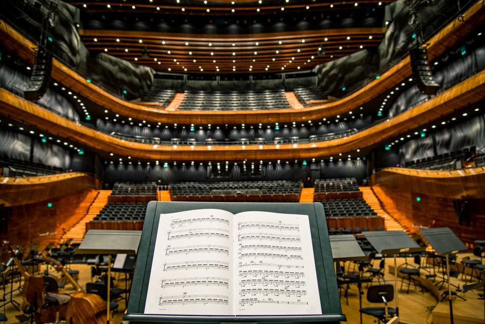 Empty seats facing a concert hall stage
