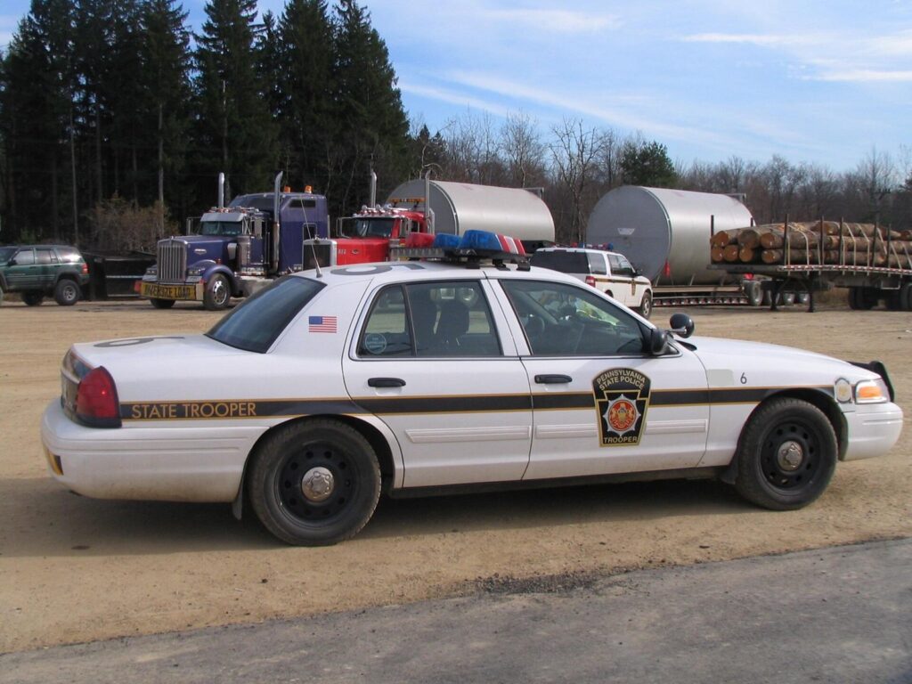 Highway patrol car on the shoulder of a road