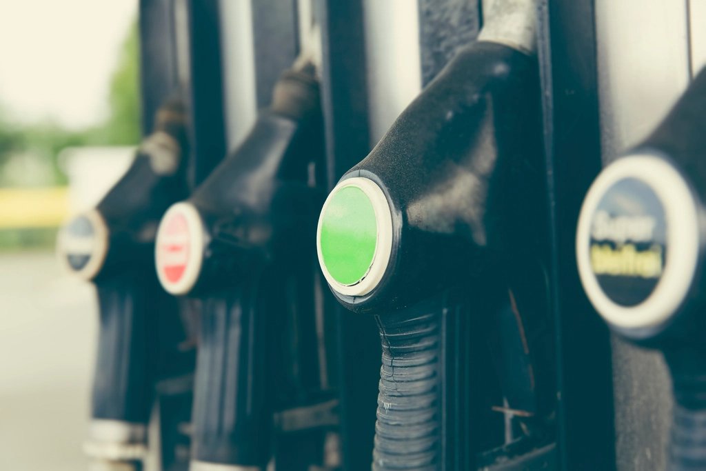 Fuel pump nozzles at a gas station